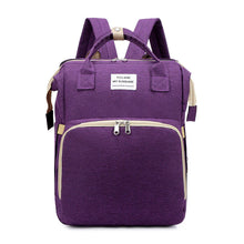 Load image into Gallery viewer, Mommy Phoenix™- Mommy Diaper Bag in purple, multifunctional and stylish for parents, featuring portable baby bed and travel bassinet functions.
